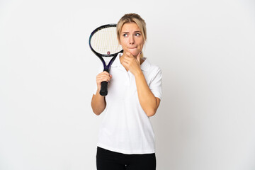 Young Russian woman tennis player isolated on white background having doubts and thinking