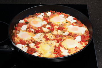 Preparing Shakshuka With Feta for dinner