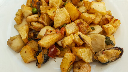 fried potatoes with vegetables and meat, traditional dish of Sa Pobla, majorca, spain