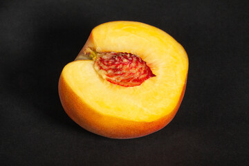 sliced peach on black background