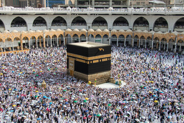 Holy Kaaba. Crowd of people always walking around Kaaba making Tawaf during Hajj.
