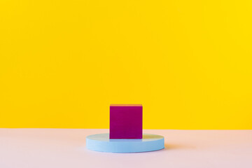 Empty colored bright podiums of abstract geometric shapes for product presentations. Copy space.