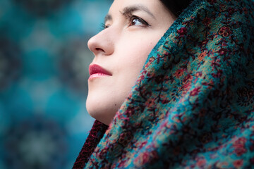 Portrait of a beautiful Tatar muslim woman in a headscarf near the blue mosque.