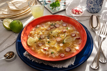 Close-up of a Peruvian ceviche with pieces of fish and lemon