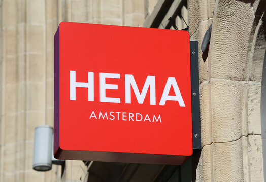 D&uuml;sseldorf, Germany - February 9. 2021: View on sign with logo lettering of hema department store at store front