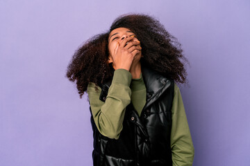 Young african american curly woman isolated on purple background laughing happy, carefree, natural emotion.