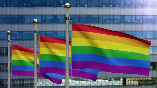 3D illustration Pride gay flag waving in a modern skyscraper city. Beautiful tall tower with LGBT rainbow banner blowing soft silk. Cloth fabric texture ensign background.-Dan