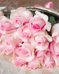 A bunch flowers of fresh light pink roses. Beautiful rose in a bud