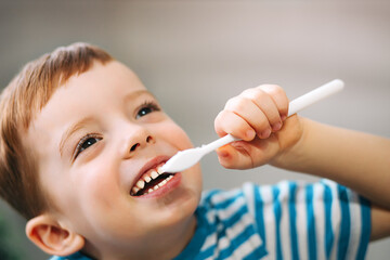 child brushing teeth