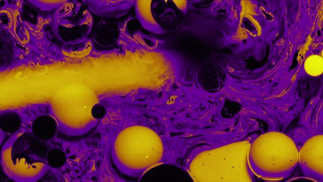 Abstract colorful fluid art painting background. Pouring technique. Liquid marble. Alcohol inkscape. Macro top view. Violet, yellow and black color palette.