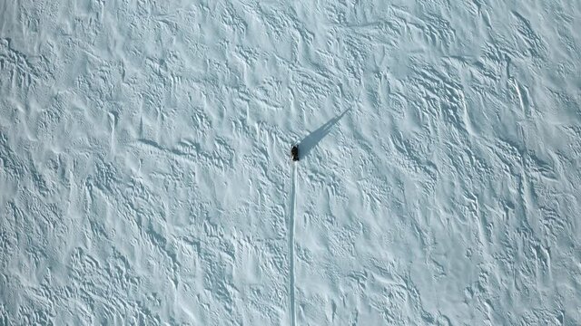 Aerial view of snowmobile in snow winter day in Russia