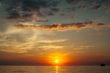 Naklejka na ściany i meble View of the beautiful sunset over ocean.