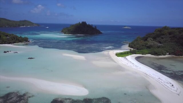 blue ocean and sandbars and islands of Saint-Anne Marine National Park drone flight