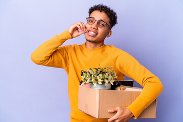 Young african american curly man isolated moving to a new home with fingers on lips keeping a secret.