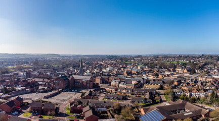 A panorama aerial view over the rooftops of Market Harborough, UK in springtime