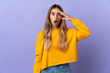 Young hispanic woman over isolated purple background has realized something and intending the solution