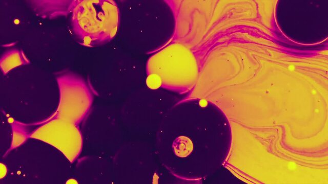 Abstract colorful fluid art painting background. Pouring technique. Liquid marble. Alcohol inkscape. Macro top view. Magenta, yellow and black color palette.