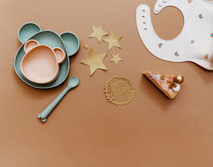 Party or birthday baby background. Flat lay composition with baby shower cake on brown background. Minimal concept
