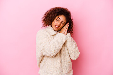 Young african american woman isolated on pink background yawning showing a tired gesture covering mouth with hand.