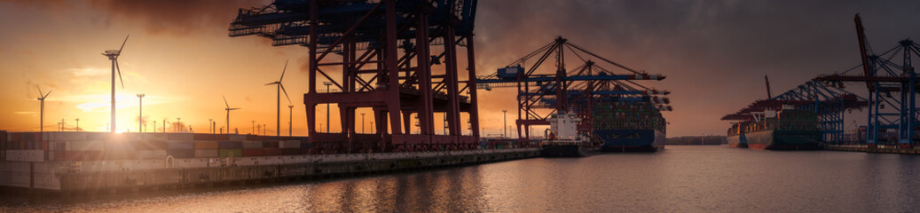 Large sunset panorama of a container terminal in Hamburg 