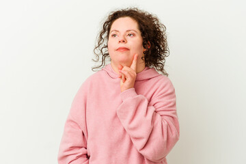 Woman with Down syndrome isolated contemplating, planning a strategy, thinking about the way of a business.