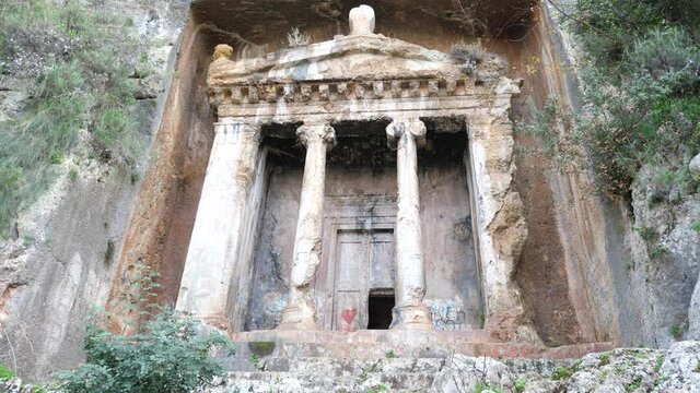 Ruins of impressive rock hewn Tomb of Amyntas at ancient Telmessos in Lycia, currently in Turkish city of Fethiye. High quality 4k footage
