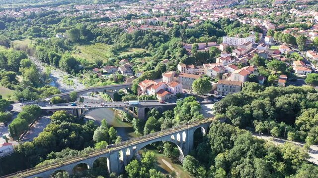 Flight over the city Ceret on summer day. France