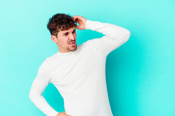 Young caucasian man isolated on blue background celebrating a victory, passion and enthusiasm, happy expression.