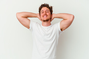 Young caucasian man isolated on white background feeling confident, with hands behind the head.