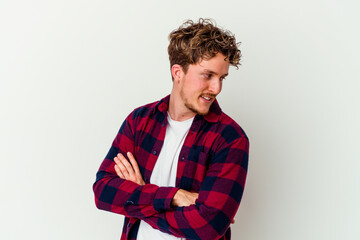 Young caucasian man isolated on white background laughing and having fun.