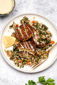 chickpea patties with tahini and Israeli salad