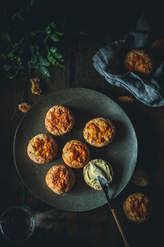 Cheese biscuits with butter ready to be eaten.