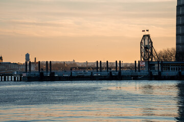 Obraz premium Jersey City, NJ - USA - Feb. 27, 2021: Landscape view of iconic the Colgate Clock at sunset. It's an octagonal clock facing the Hudson River near Exchange Place in Jersey City, New Jersey.