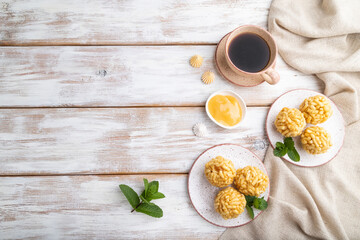Traditional Tatar candy chak-chak made of dough and honey with cup of coffee on a white wooden background. top view, copy space.