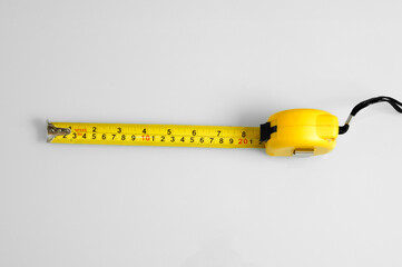 Measuring tape scale yellow roll construction tool inch centimeters size isolated on white background meter equipament work precise