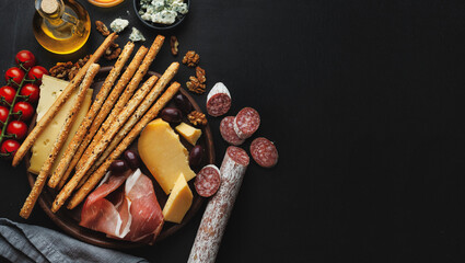 Italian appetizers on dark background