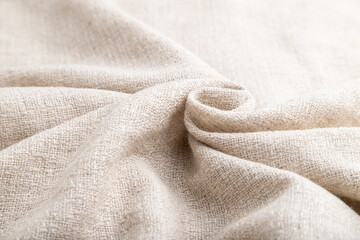 Fragment of white linen tissue. Side view, natural textile background.