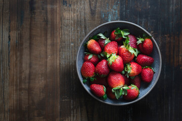 A bowl of ripe strawberries.