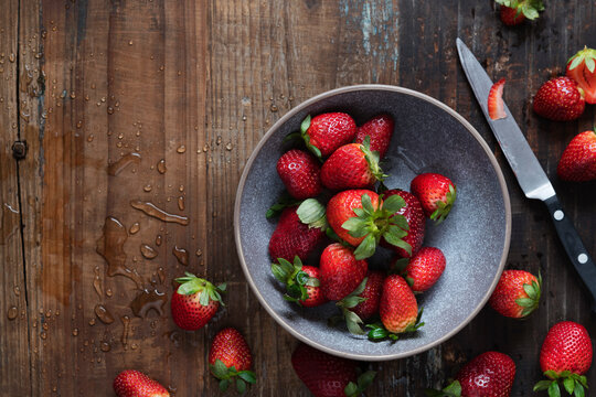 Washed ripe strawberries in a bowl.