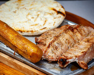 meat cutlet with arepa, ripe banana