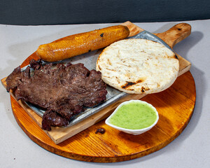 meat cutlet with arepa, ripe banana