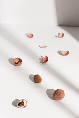 Fresh Lychee fruit on light background. Minimal fruit and summer concept.