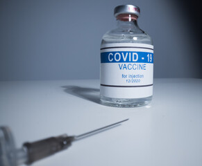 Syringe with Covid-19 vaccine - close up view macro shot