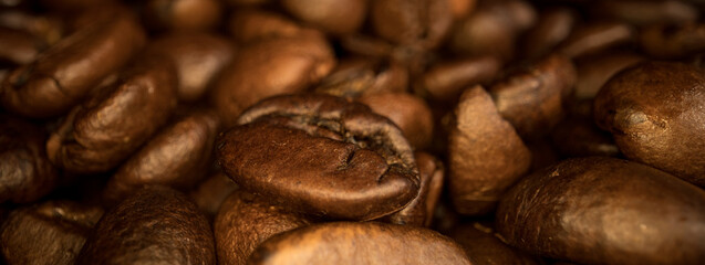 Freshly roasted Coffee Beans - sliding macro shot