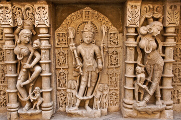 Fototapeta na wymiar Ornate carvings on wall of Rani-ki-Vav step well, Patan, Gujarat, India