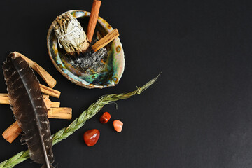A top view image of a spiritual healing smudge kit bundle on a black background.