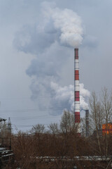 Factory pipes spoil the air with their emissions