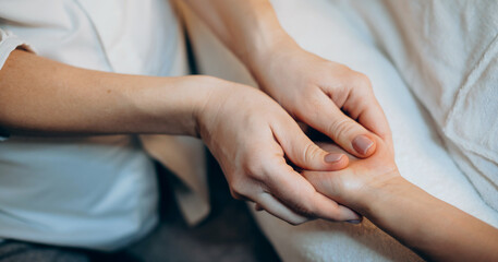 Fototapeta na wymiar Close up photo of a caucasian woman at the spa salon having a hand massage session
