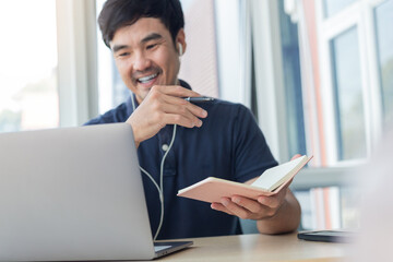 asian man work using computer hand typing laptop keyboard contact us.student study learning education online.adult professional people chatting search at office.concept for technology device business