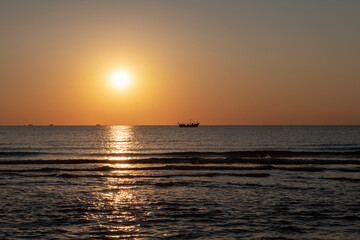 ocean boat in sunrise